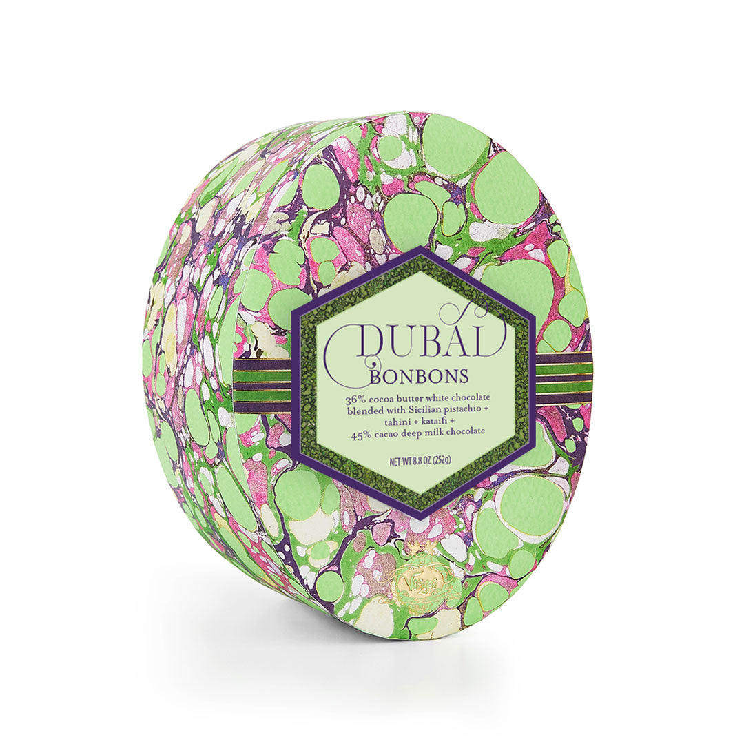 Decorative box of Dubal Bonbons with a colorful pattern on a white background