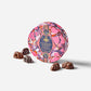 Decorative chocolate tin with 'Wandering Rabbit' branding on a white background