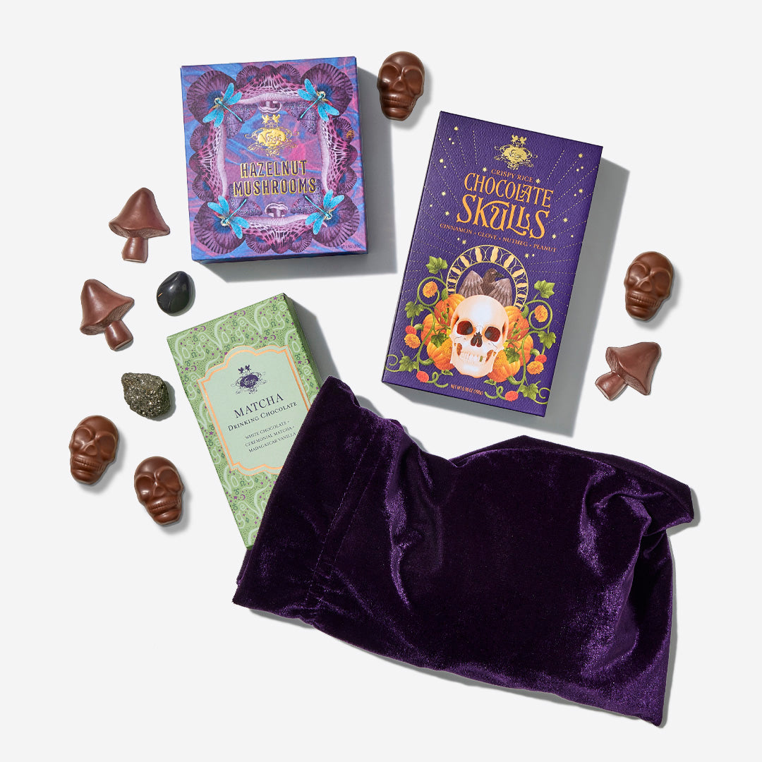 Spellbound Chocolate Menagerie gift set with three colorful illustrated boxes and assorted chocolates on white background.