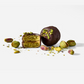 Chocolate-dipped pistachio treats on a white background
