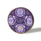 Close up of Enchanted Vegan Truffles purple tin with intricate circular designs