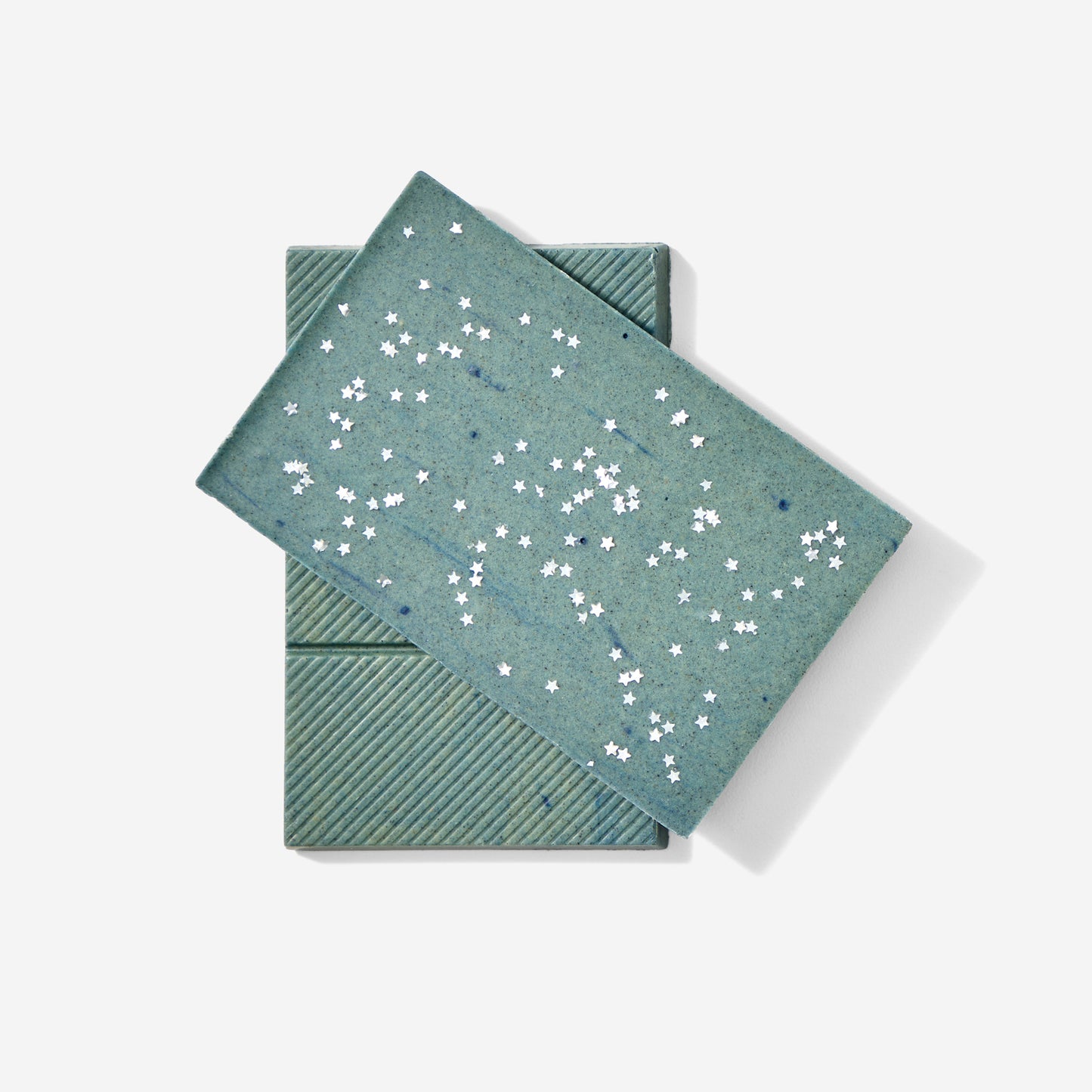 Two teal greeting cards with star patterns on a white background