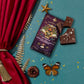 Chocolate bar with decorative packaging on a blue surface with red curtain and butterfly